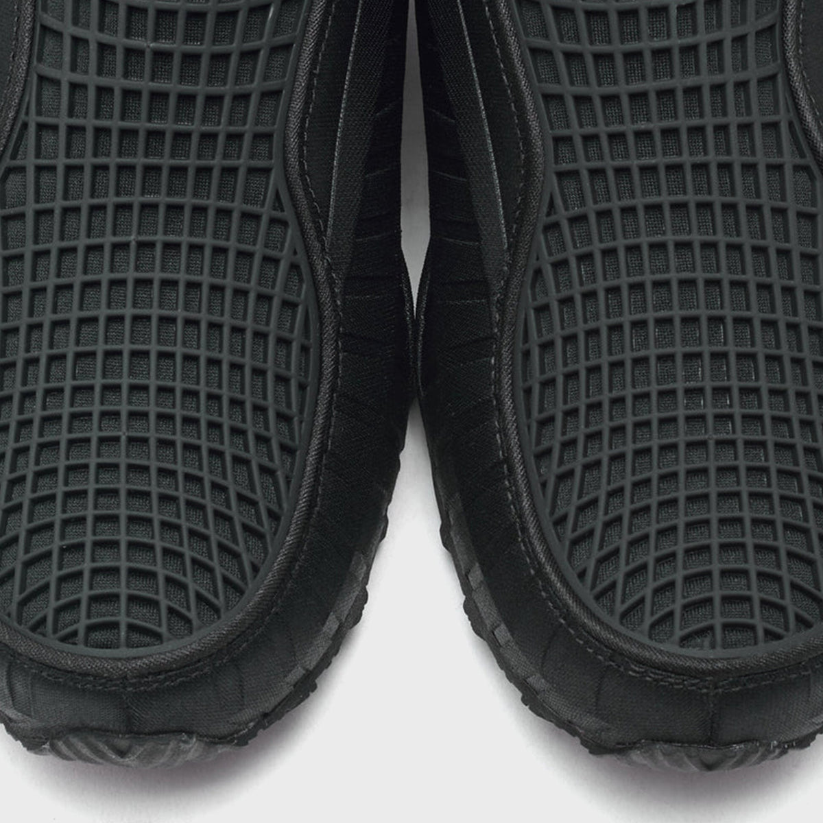 Nike WMNS Air Max Dolce Black / Sport Red close-up of pair showing black grid-pattern mesh upper and ribbed side panels