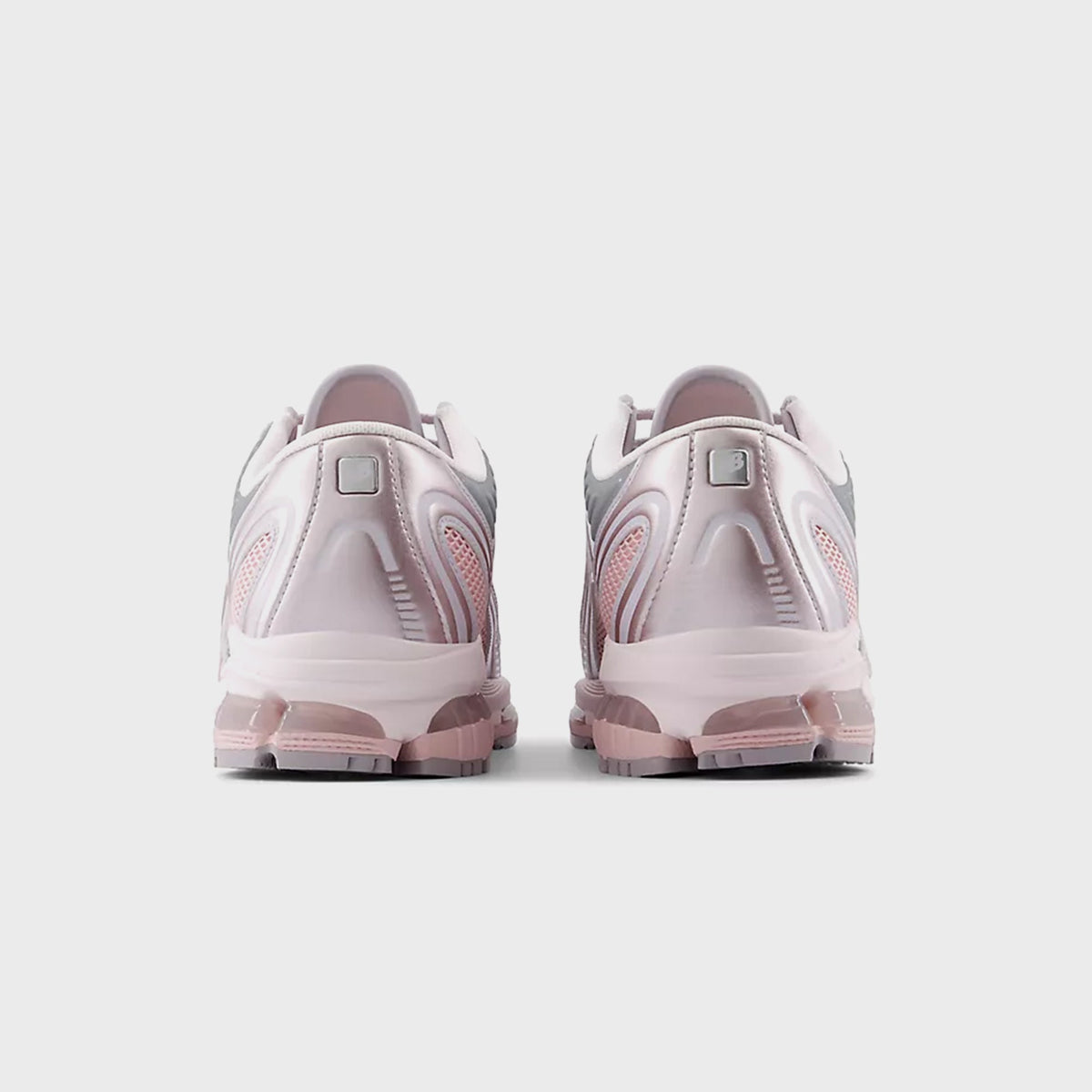 New Balance 1890A sneaker in Pink Granite / Pink Chalk, rear view of pair showing heel pull tabs and sole
